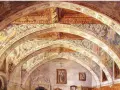 Interior de la iglesia de Villanueva de Sigena, con bóvedas decoradas con frescos y arcos ornamentados.