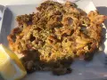 Tapa de calamares fritos con limón, perfecta para saber donde comer en Ávila.