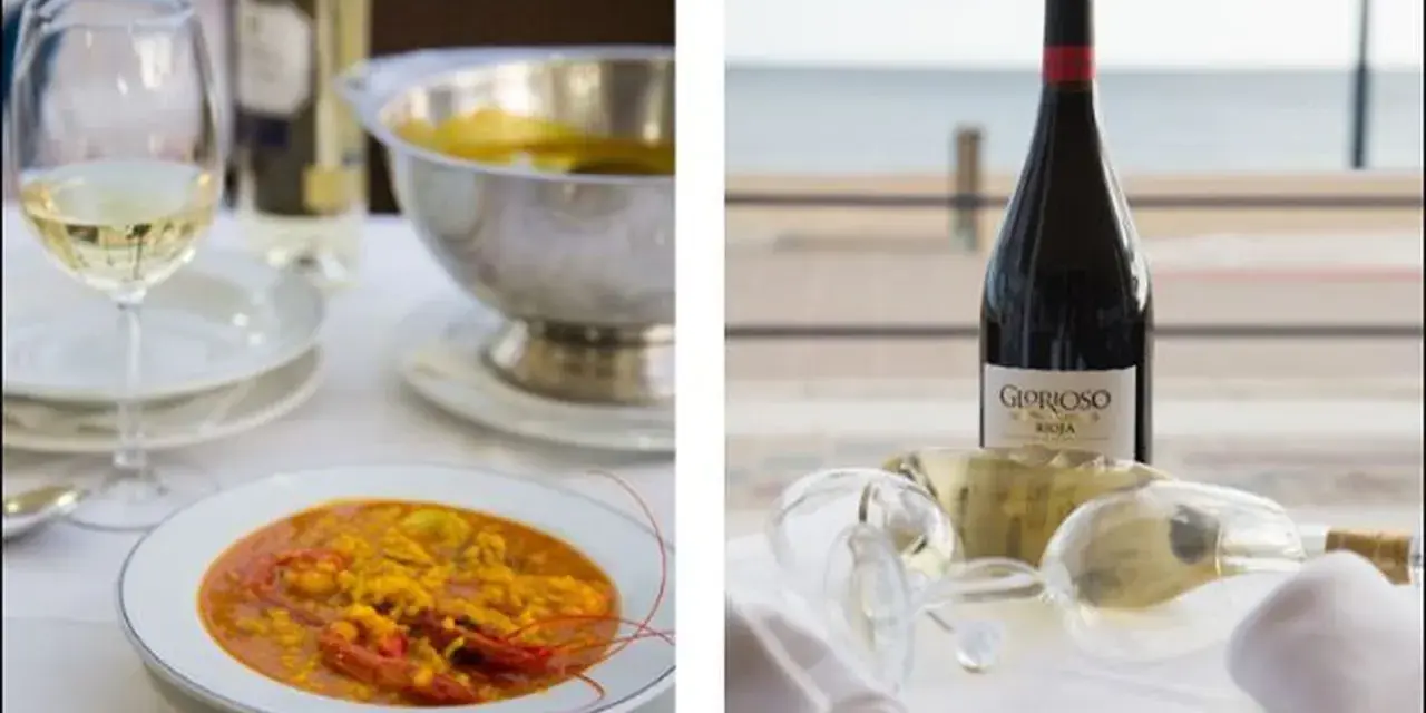 Paella y vino en Islantilla. Descubre dónde comer en Islantilla y disfruta de esta deliciosa combinación.