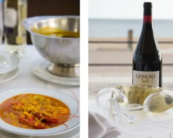Paella y vino en Islantilla. Descubre dónde comer en Islantilla y disfruta de esta deliciosa combinación.