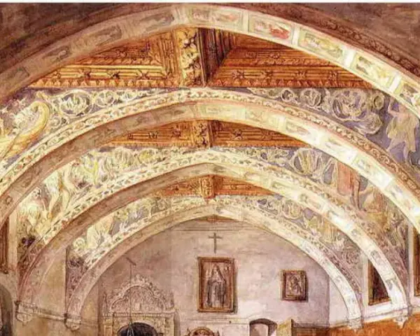 Interior de la iglesia de Villanueva de Sigena, con bóvedas decoradas con frescos y arcos ornamentados.