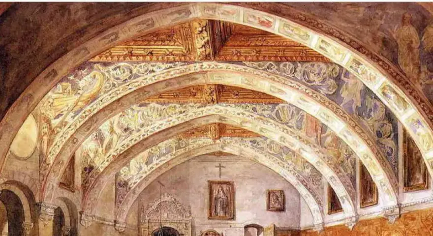 Interior de la iglesia de Villanueva de Sigena, con bóvedas decoradas con frescos y arcos ornamentados.